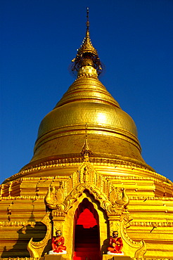 Golden stupa of Kuthodaw Paya against the blue sky Mandalay Burma