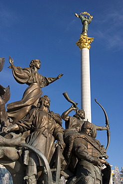 Ukraine Kiev Place of Independence memorial of the founder of the city of Kiev sovereigns Kyj, Scek, Chryv and their sister LybidÂ´ memorial in bronze shining blue sky historical memorial column of Independence 2004