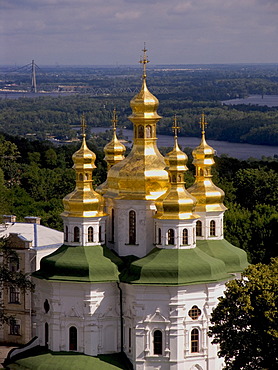 Ukraine Kiev the monastery of cave Kyjevo PecersÂ´ka Lavra view to church of godmothers birth with shining golden domes and crosses in background river Dnepr 2004