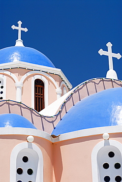 Light pink church, chapel with blue domes in Mykonos City, Cyclades, Greece, Europe