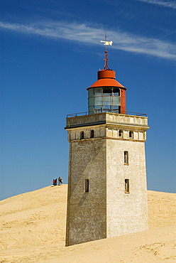 Lighthouse buried by a shifting sand dune at Rubjerg near Loekken, Jutland, Denmark