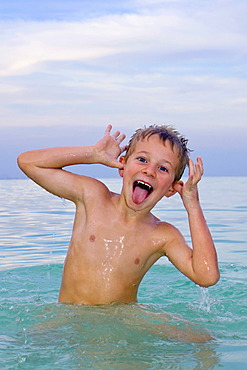 Boy, 6 years old, swimming in the sea, playful