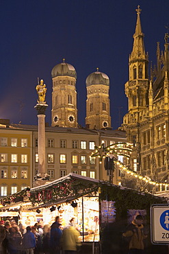 Christmas market on Marien-Place Munich with Marien-clumn townhall and cathedral Bavaria Germany