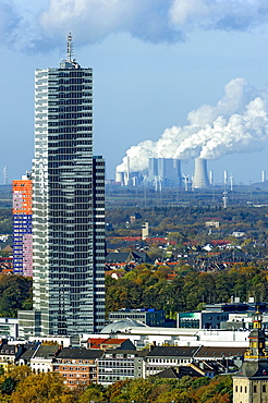 KÃƒÂ¶lnturm tower in the Mediapark, Neurath coal-fired power plant of RWE at the back, Grevenbroich, Cologne, North Rhine-Westphalia, Germany, Europe