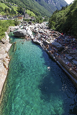 Bathing people on rocks at Verzasca, near Lavertezzo, Verzascatal, Valle Verzasca, Canton Ticino, Switzerland, Europe