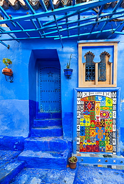 Blue front door, colorful painting on house facade, blue painted house, medina of Chefchaouen, Chaouen, Tanger-Tétouan, Kingdom of Morocco