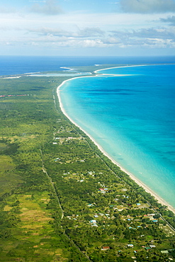 Coastline with beach and village, Ouvea island, New Caledonia, Oceania