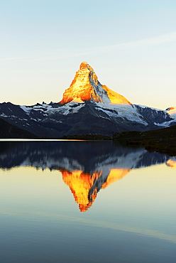 Matterhorn reflected in lake Stellisee, at sunrise, Valais Alps, Canton of Valais, Zermatt, Switzerland, Europe