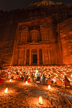 People sitting in front of candles, Pharaoh's treasure house beaten into rock at night, facade of the treasure house Al-Khazneh, Khazne Faraun, mausoleum in the Nabataean city of Petra, near Wadi Musa, Jordan, Asia