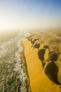 Aerial view, sandunes of the Namib desert floating in the Atlantic ocean, Namibia, Africa