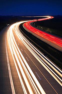 Light tracks on the A14 motorway at night, near Halle an der Saale, Saxony-Anhalt, Germany, Europe