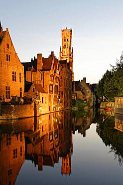 Illuminated historical houses with water reflection at dusk, Rozenkaai, Kanal Dijver, blue hour, Bruges, Belgium, Europe