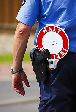 Police officer with sign, stop police and pistol, Erfurt, Germany, Europe