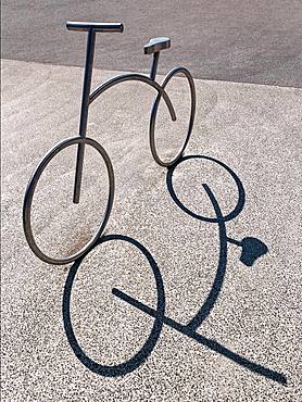 Bicycle, bicycle stand, stainless steel bicycle park, casts shadow, Aalborg, Jutland, Denmark, Europe