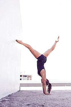 Young woman in swimsuit, handstand, gymnastics, Cape Town, South Africa, Africa