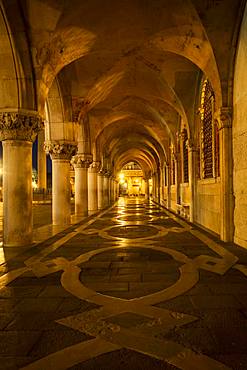 Colonnade of Doge's Palace (Palazzo Ducale) at night, Piazetta San Marco, Venice, Veneto, Italy, Europe