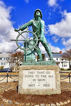 Bronze statue of a man at the wheel, Gloucester fisherman's Memorial, Memorial for castaways with inscription from biblical Psalm, Gloucester, Cape Ann, Massachusetts, New England, USA, North America