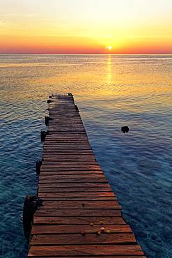 Boat jetty, wooden jetty in the sea at sunset, Selayar Dive Resort, Selayar Island, South Sulawesi, Sulawesi, Indonesia, Asia