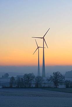 Wind power plants, silhouettes in dawn, Swabian Alb, Baden-Wuerttemberg, Germany, Europe