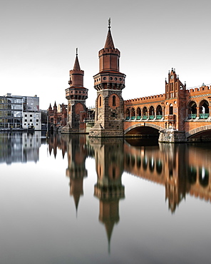 Berlin Oberbaum Bridge at Warschauer Strasse in Berlin with reflection in the Spree, Berlin, Germany, Europe