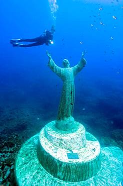 Diver at Christ statue under water, Mediterranean Sea, bay of San Fruttuoso, Portofino, Liguria, Italy, Europe