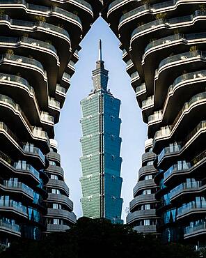 View of Taipei 101 Tower, framed by a high-rise building, Taipei, Taiwan, Asia