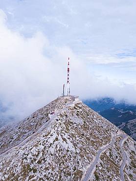 Aerial view, Sveti Jure mountain top with antenna surrounded by fog, Biokovo nature park Park, Croatia, Europe