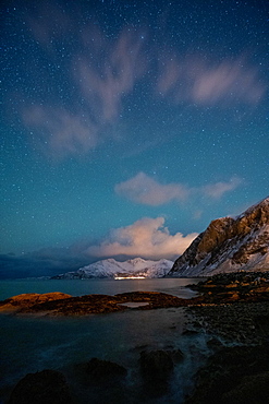 Northern lights over a Norwegian fjord, Tromso, Norway, Europe