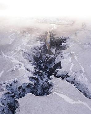 Aerial view, Fjaorargljufur Canyon with golden light and clouds, Kirkjubaejarklaustur, Iceland, Europe