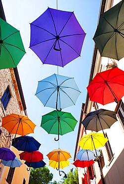 Colorful umbrellas as decoration in the old town, Novigrad, Adriatic coast, Istria, Croatia, Europe