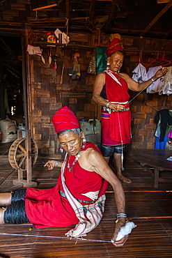 Old Kayan women weaving the traditional way, Kayah village, Loikaw area, Kayah state, Myanmar, Asia