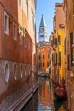 Narrow canal with gondola, view of Campanile di San Marco bell tower, Venice, Veneto, Italy, Europe