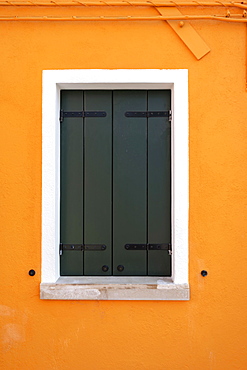 Orange wall with window, colorful house wall, closed shutters, colorful facade, Burano Island, Venice, Veneto, Italy, Europe