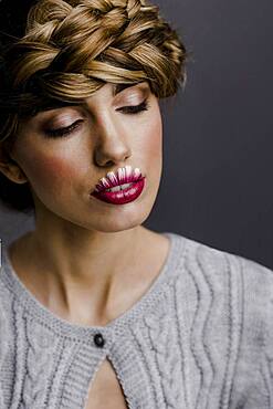 Young woman with flower lips