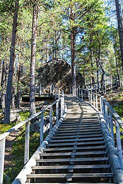 Wooden stairs to the ""Bear's Den"" Tafone Rock, Lapland, Inari, Finland, Europe