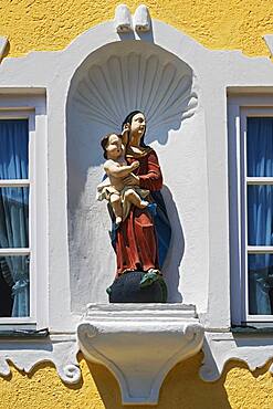 Figure of the Madonna with baby Jesus and snake in the Marktstrasse, Bad Toelz, Upper Bavaria, Bavaria, Germany, Europe