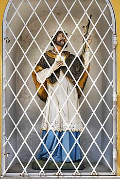 Figure of saint behind lattice, Bad Toelz, Upper Bavaria, Bavaria, Germany, Europe