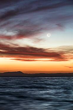 Moon at sunset at Lake Taupo, Waikato, North Island, New Zealand, Oceania