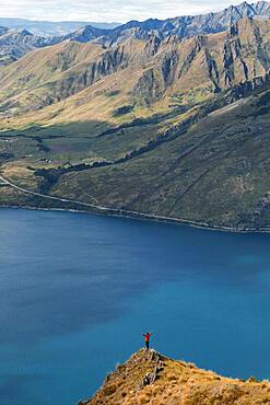 Guy on a mountain at Lake Hawea, Otago Region, Queenstown-Lakes District, South Island New Zealand