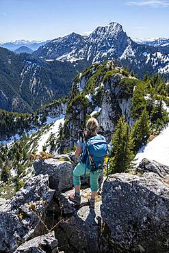 Hiker on the summit of Breitenstein, behind Wendelstein, Fischbachau, Bavaria, Germany, Europe