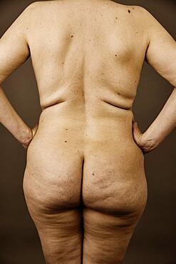 Female nude, back view of an older, thicker woman with wrinkles, studio shot, Germany, Europe