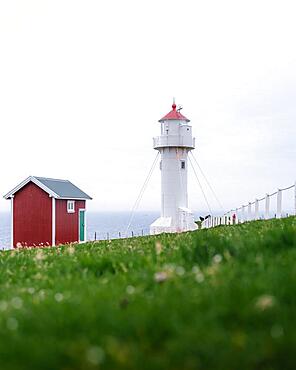 Akraberg Lighthouse with red hut, Sumba, Suduroy, Faroern Islands