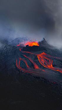 Aerial view, erupting volcano with lava fountains and lava field, crater with erupting lava and lava flow, Fagradalsfjall, Reykjanes Peninsula, Iceland, Europe