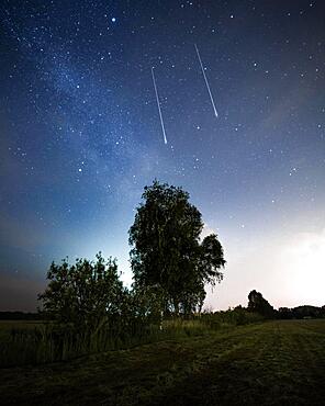 Two shooting stars with milky way in Brandenburg, Germany, Europe