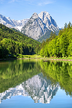 Mountains reflected in the lake, Riessersee, behind summit Mittlere und Innere Hoellentalspitze, Vorderer und Grosser Waxenstein, Riess, Garmisch-Partenkirchen, Wetterstein Mountains, Werdenfelser Land, Alps, Upper Bavaria, Bavaria