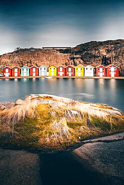 Boats and colourful boathouses in Smoegen Harbour, Smoegenbryggan, Vaestra Goetalands Laen, Bohuslaen, Sweden, Europe