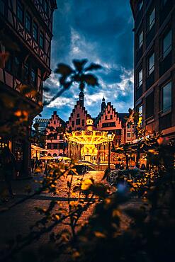 Frankfurt Christmas Market, with large historic carousel on the Roemer, with its half-timbered houses, Blue Hour, Frankfurt am Main, Hesse, Germany, Europe