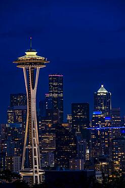 View over illuminated skyscrapers of Seattle, skyline with observation tower Space Needle, blue hour, Seattle, Washington, USA, North America