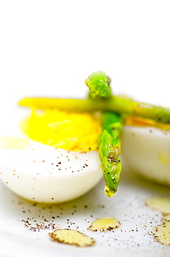 Boiled fresh green asparagus and eggs with extra virgin olive oil