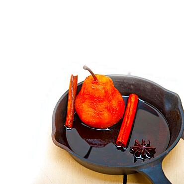 Poached pears delicious home made recipe ove white rustic wood table